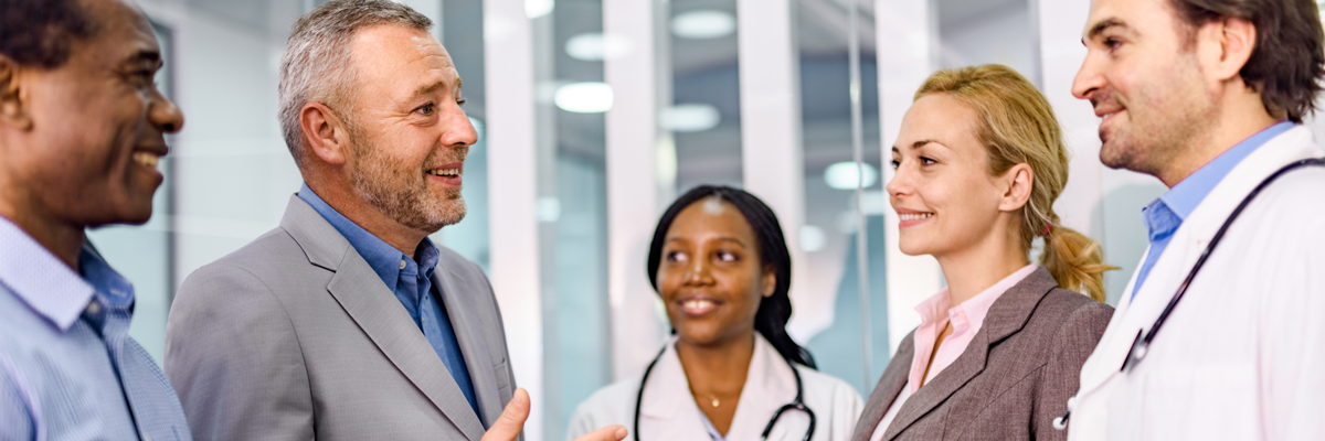 group of clinical professionals communicating with hospital admin