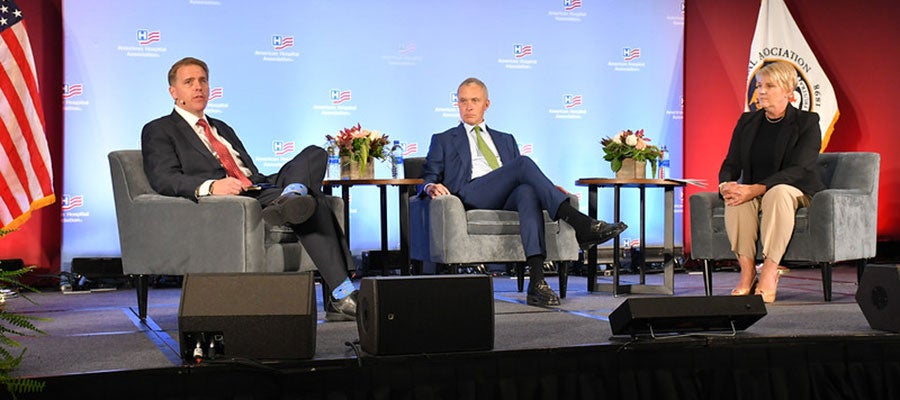 Scott-Jennings-Harold-Ford-Jr-and-Stacey-Hughes-are-seated-onstage-in-a-semicircle